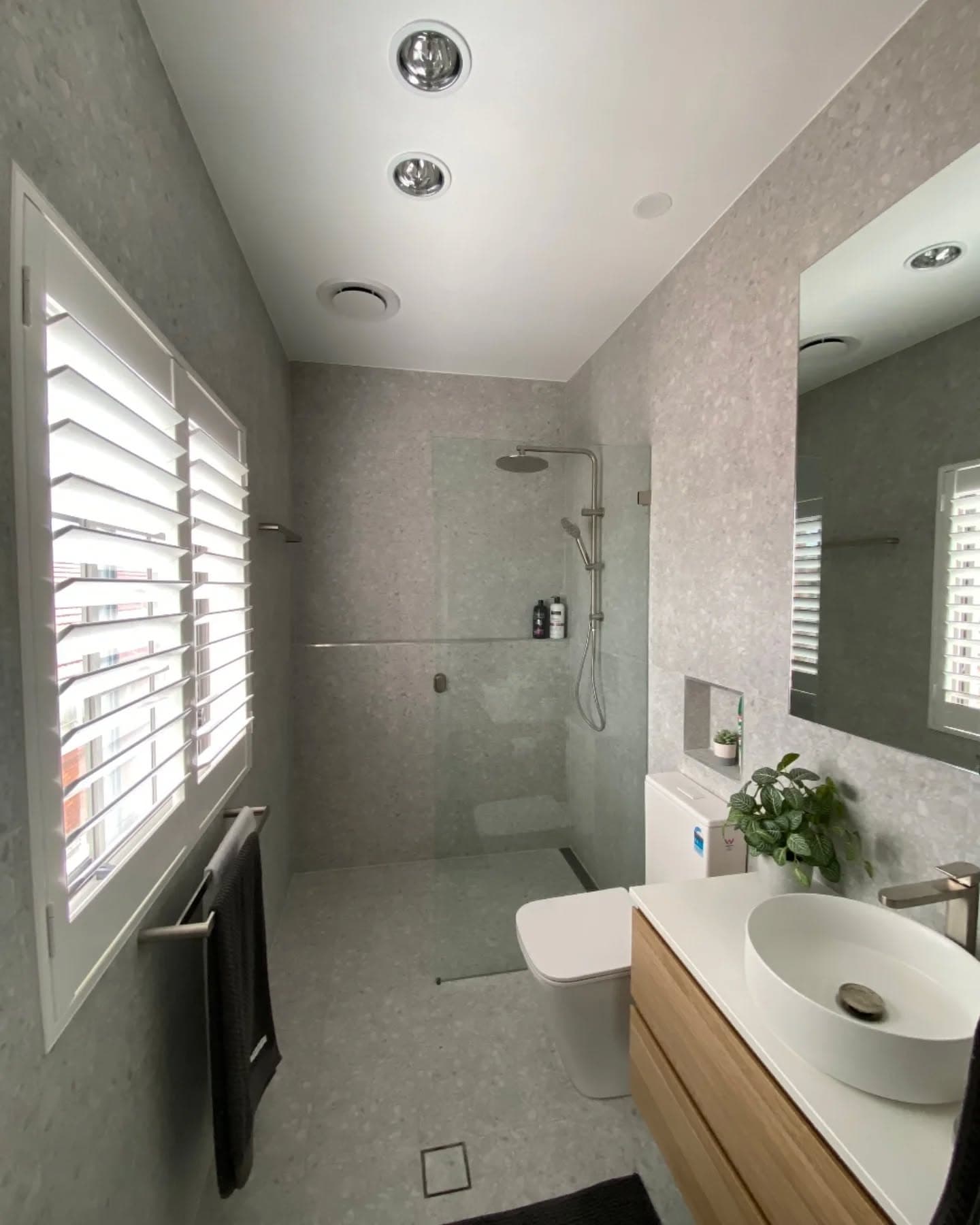 Modern grey bathroom renovation by HBN Constructions