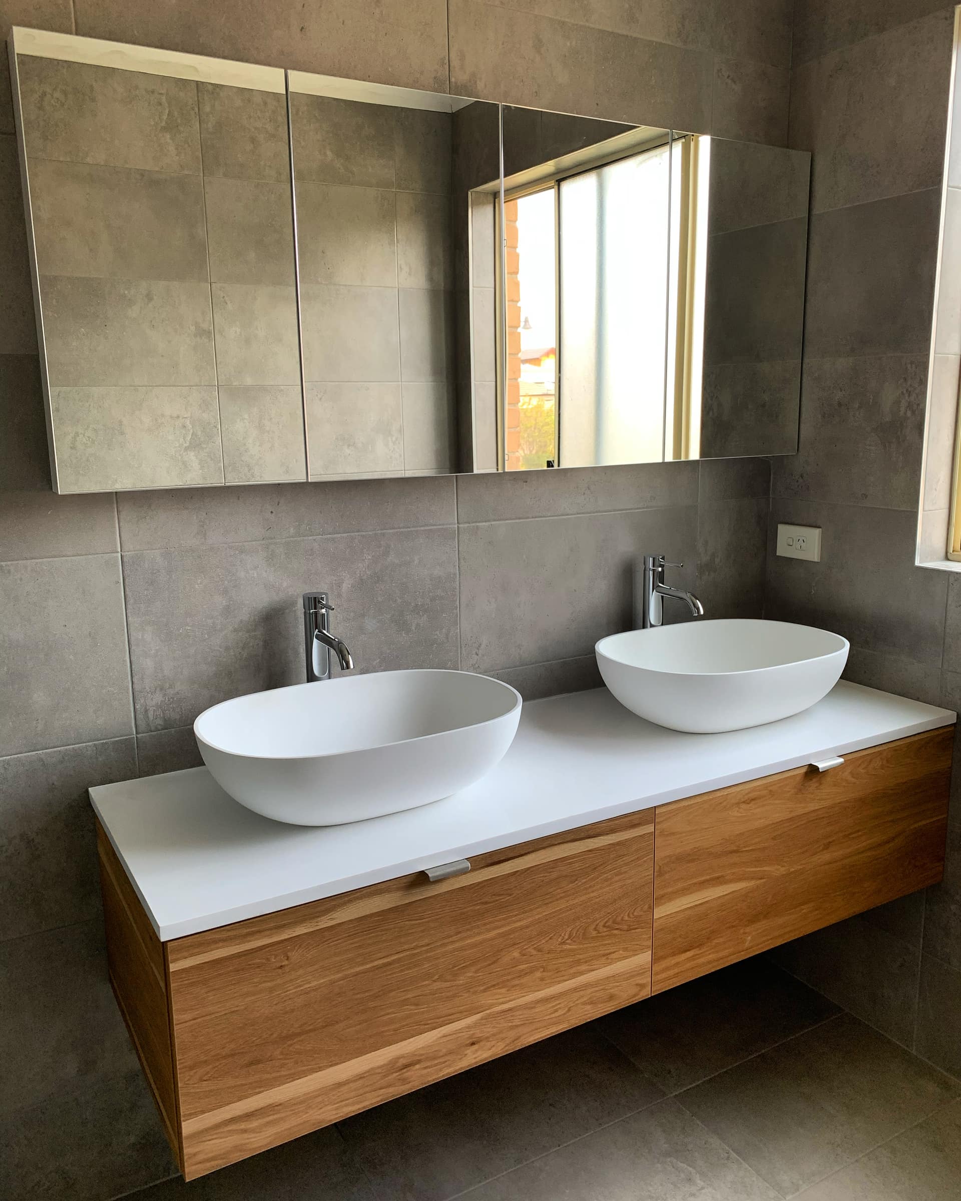 Double timber vanity with twin vessel basins